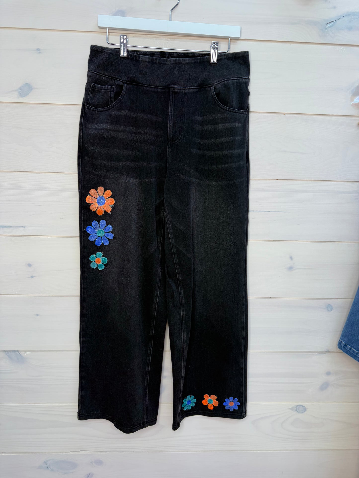 Black daisy hand painted pull on jeans